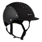 3/4 front view of A black equestrian riding Casco helmet with a matte finish, featuring a velour fabric visor and top, decorative crystals, against white background