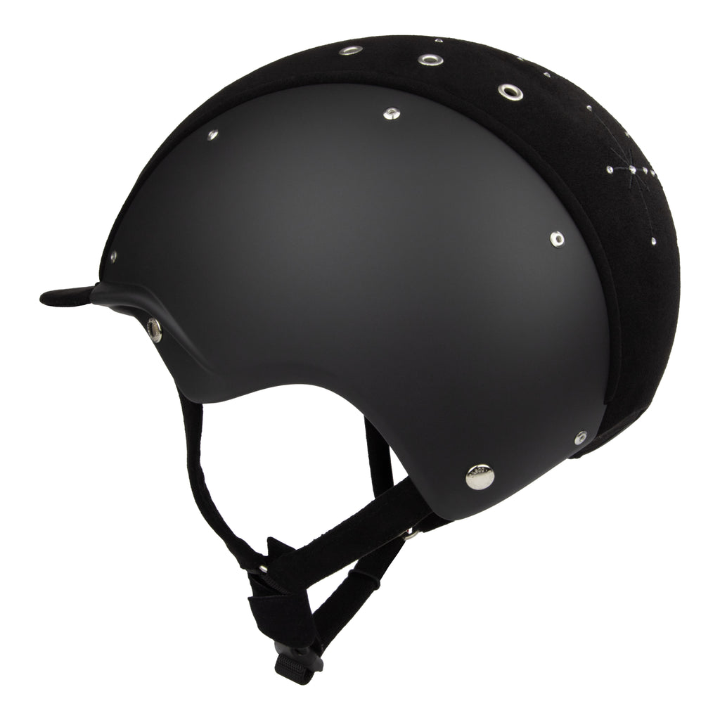Side view of A black equestrian riding Casco helmet with a matte finish, featuring a velour fabric visor and top, decorative crystals, against white background