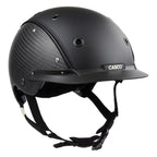 A mat black equestrian riding CASCO helmet made with mat carbon side panel, 3/4 front view against white background 