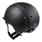 A mat black equestrian riding CASCO helmet made with mat carbon side panel, 3/4 rear view against white background 