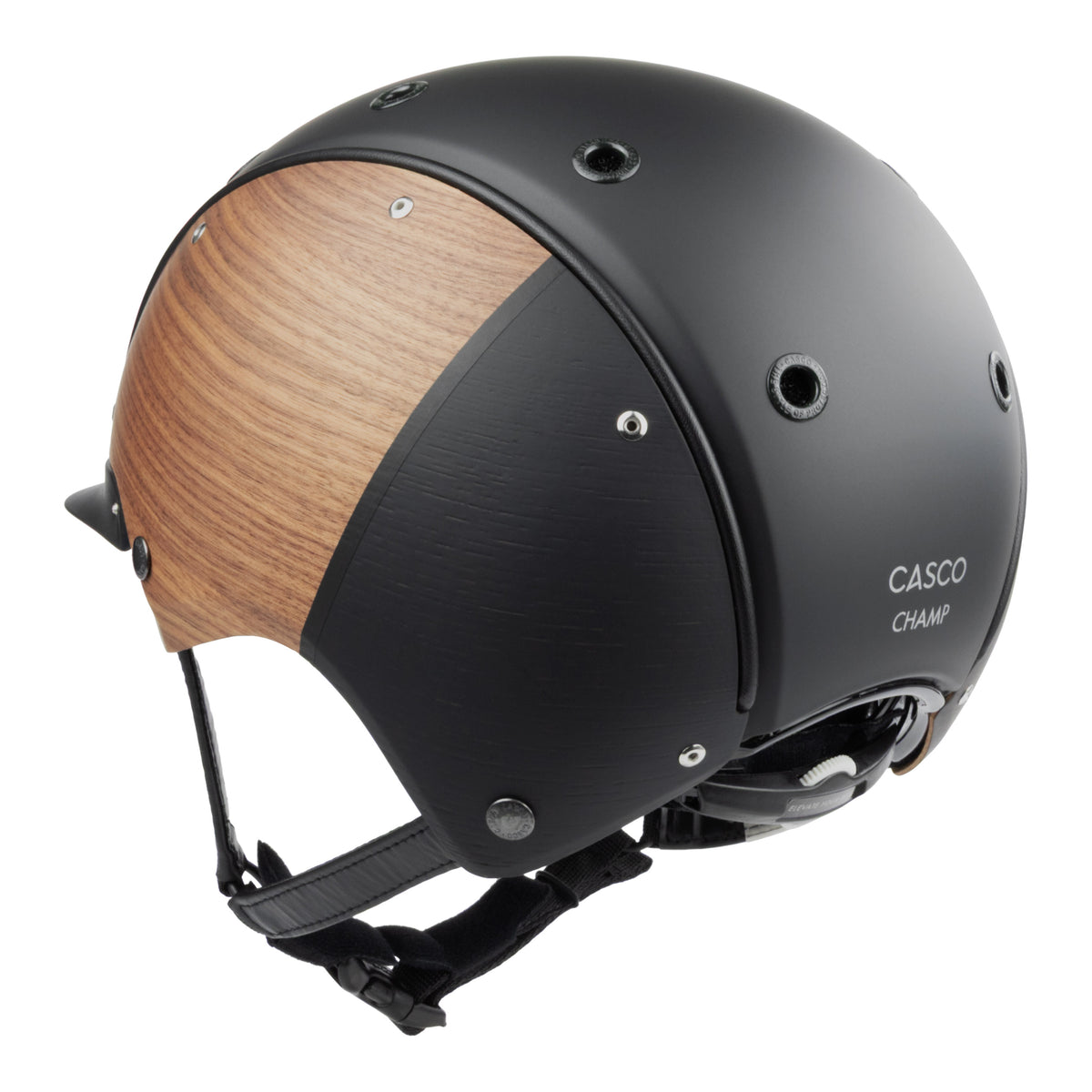 A matte black equestrian riding Casco helmet with natural wood-look panels on the sides, featuring a black chin strap and a visible 'CASCO' brand  on the back against white background
