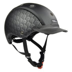 A CASCO matte black equestrian helmet with a subtle repeating logo pattern on the side panels, a matching black visor, and black chin straps with an orange release buckle, shown on a solid white background.