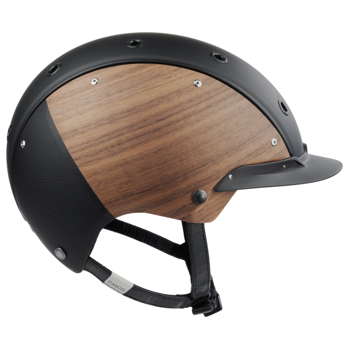 A matte black equestrian riding Casco helmet with natural wood-look panels on the sides, featuring a black chin strap, side view  on the back against white background