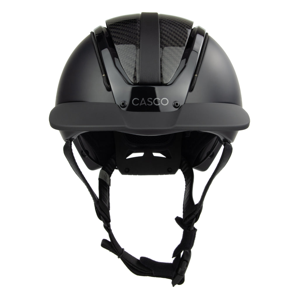 A black mat equestrian riding CASCO helmet with shiny top carbon parts, front view against white background