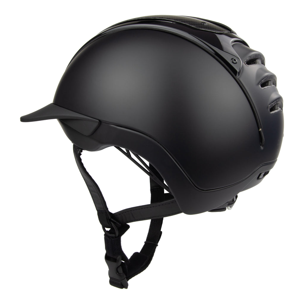 A black mat equestrian riding CASCO helmet with shiny top carbon parts, side view against white background