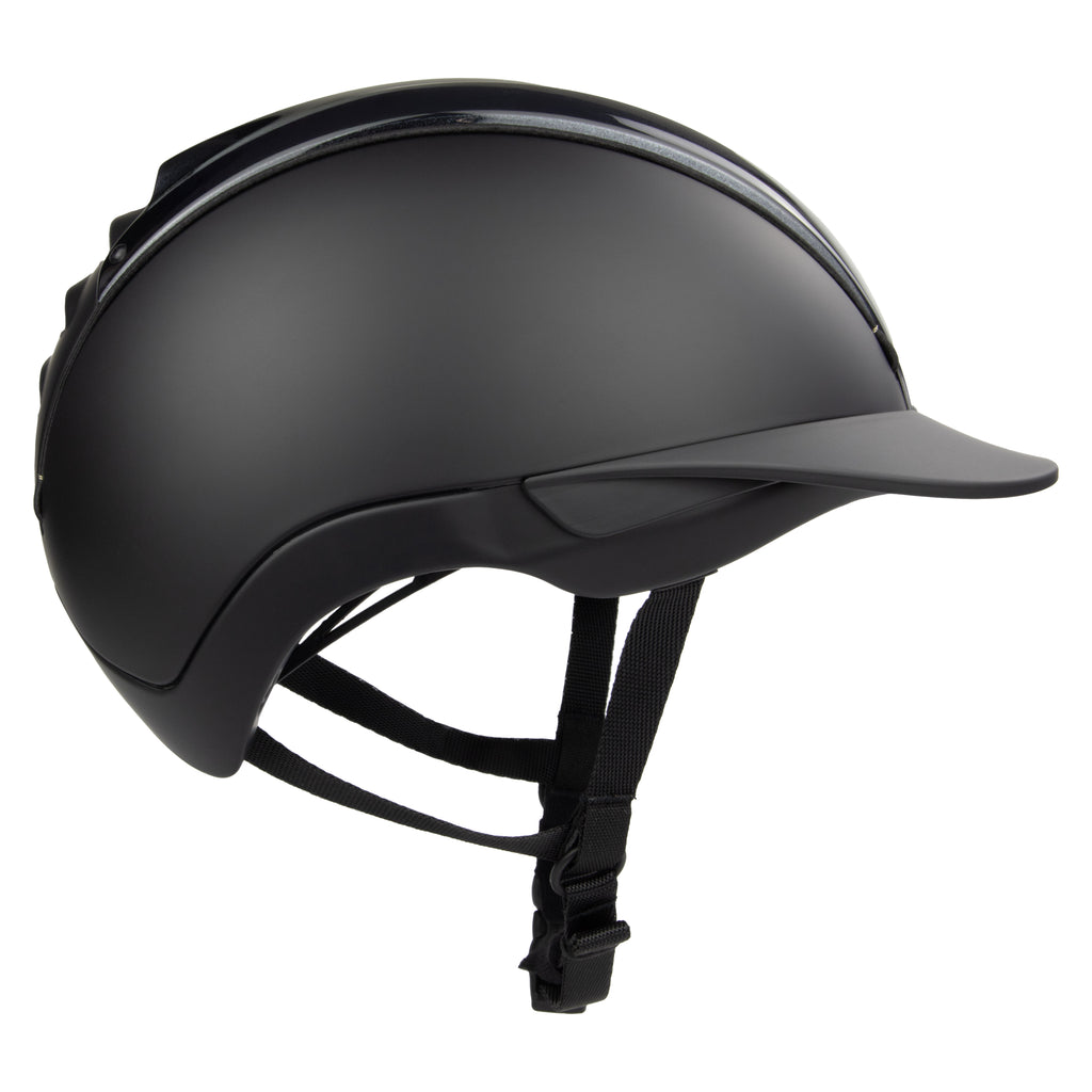 A matte black equestrian riding CASCO helmet with a visor and adjustable chin strap, shown from a three-quarters angle on a white background.