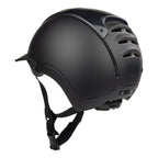 A matte black equestrian riding CASCO helmet with a chin strap, shown from a three-quarters angle against a solid white background.