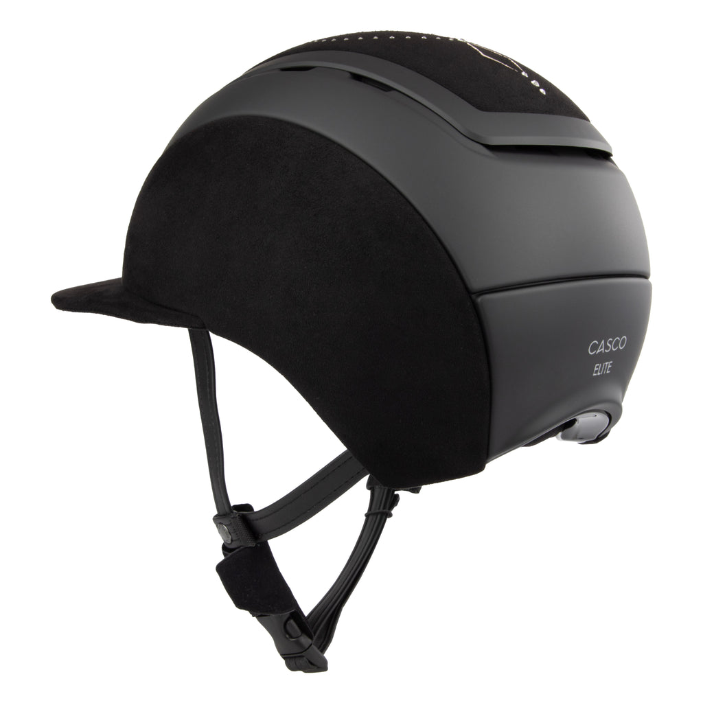 Rear 3/4 view of A black Casco equestrian riding helmet with a matching visor, matte finish, brushed nubuck leather with Swarovski crystals and adjustable chin strap, shown on a solid white background.