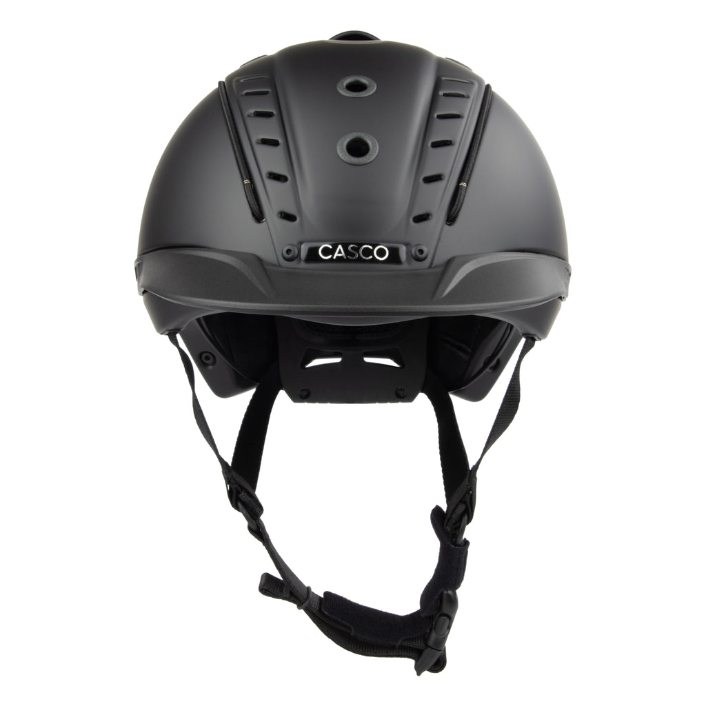 Matte black Casco equestrian riding helmet shown from the front, featuring the brand name 'CASCO' on a silver plate on the back, with black chin straps hanging below, set against a plain white background.