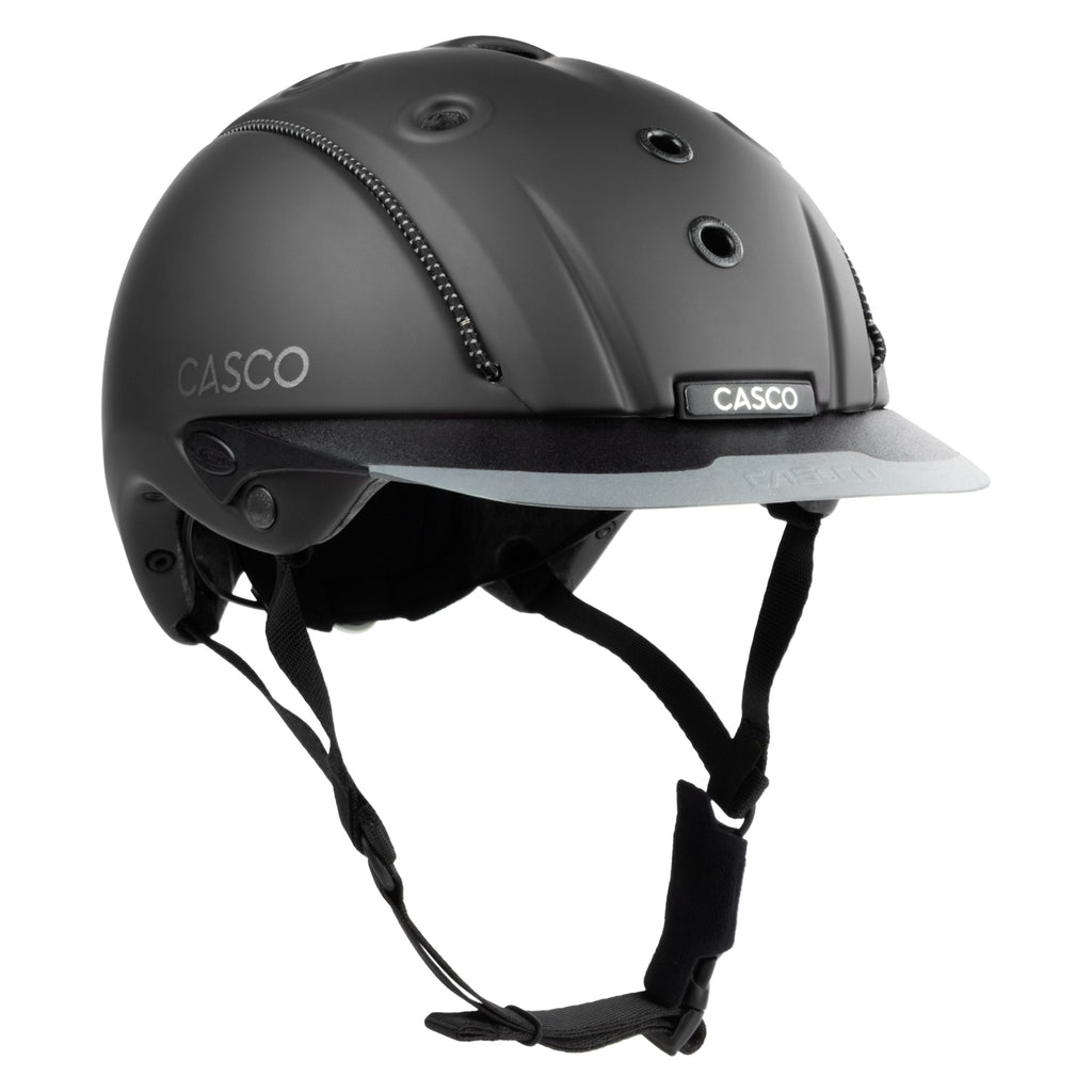 A matte black Casco equestrian helmet with a matching visor and black chin straps, shown from a three-quarters angle on a white background.