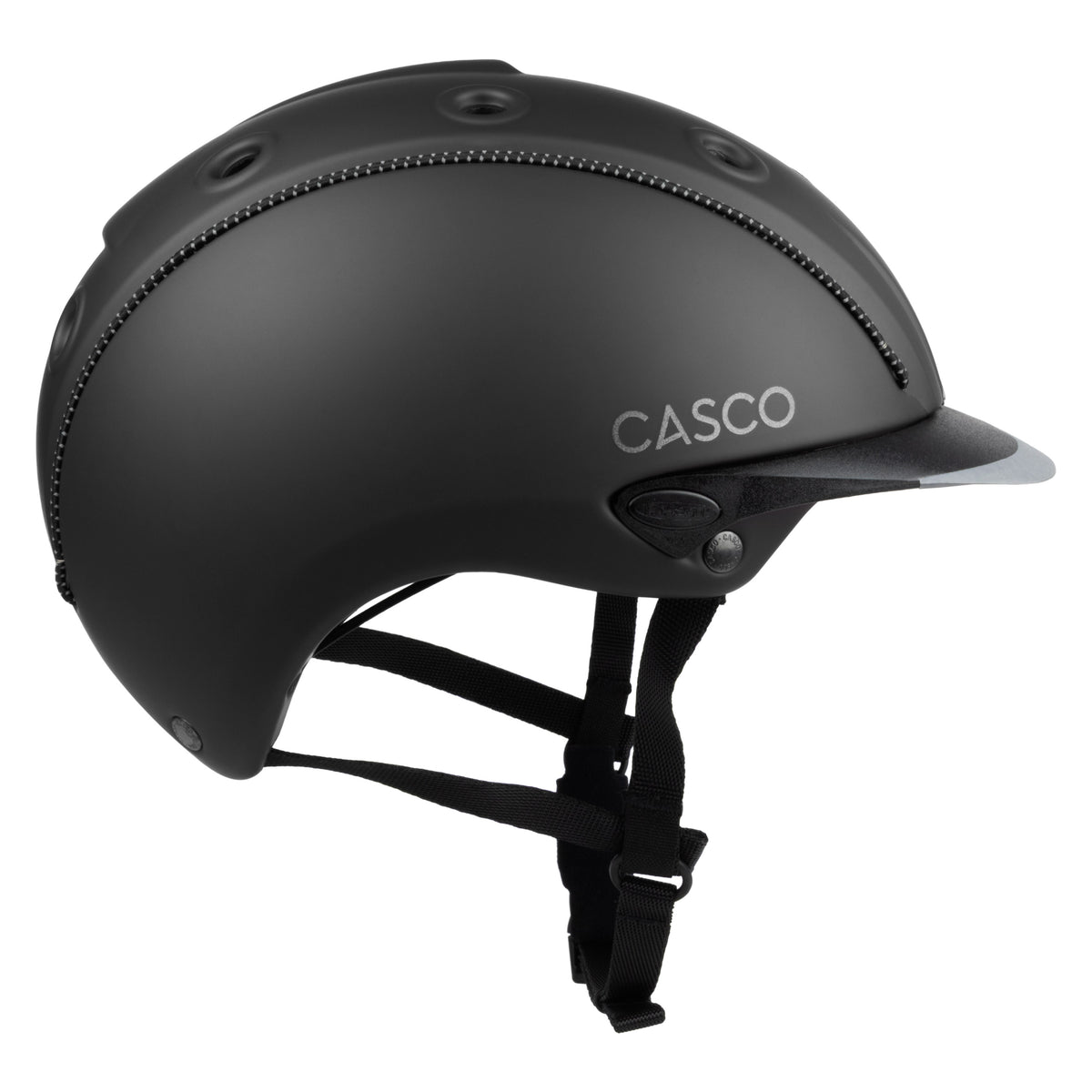 Matte black Casco equestrian helmet with a visor and black chin strap, shown from a side profile on a white background.