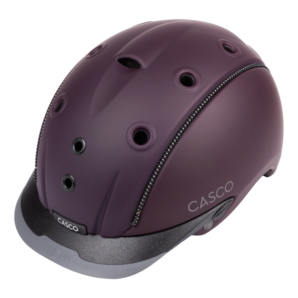 A matte dark purple Casco equestrian riding helmet with a matching visor and black chin straps, shown from a three-quarters angle on a white background.