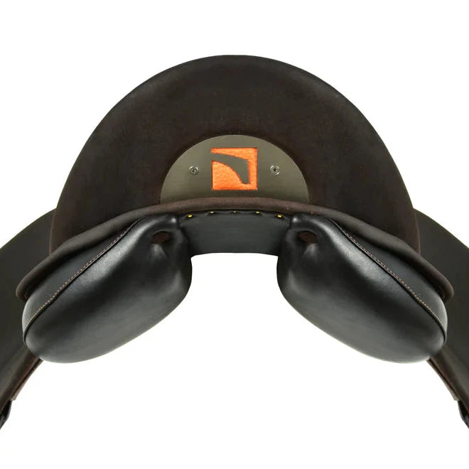 A close-up of a Childeric DPL dressage black leather saddle with an orange logo badge on the back, isolated on a white background.