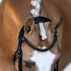 A palomino horse head wearing the Lumiere Onyx browband handcrafted from Austrian stellux crystals on super supple black Italian leather featuring a centre row of square-cut crystals encased by two rows of smaller stones 