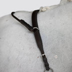 Close-up of a white horse wearing the Lumiere Parker bridge breastplate 