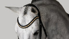 A gray horse wearing the Lumiere Ariana browband featuring a wide deep-drop crystal design — gold-toned Austrian stellux crystals framed by black crystals - Patent leather loops