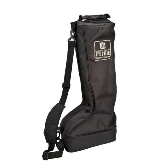 A black Petrie riding boots bag with an adjustable shoulder strap and a white brand patch on the upper front, shown against a plain white background.