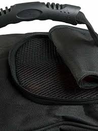 Close-up of the Petrie riding boots bag in black, top part, textured fabric with a mesh pocket for airflow and a rolled black handle.
